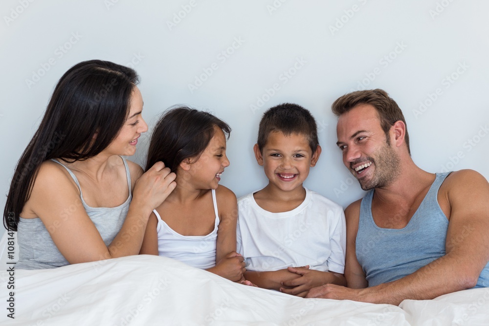 Happy family in their bedroom Happy family in their bedroom