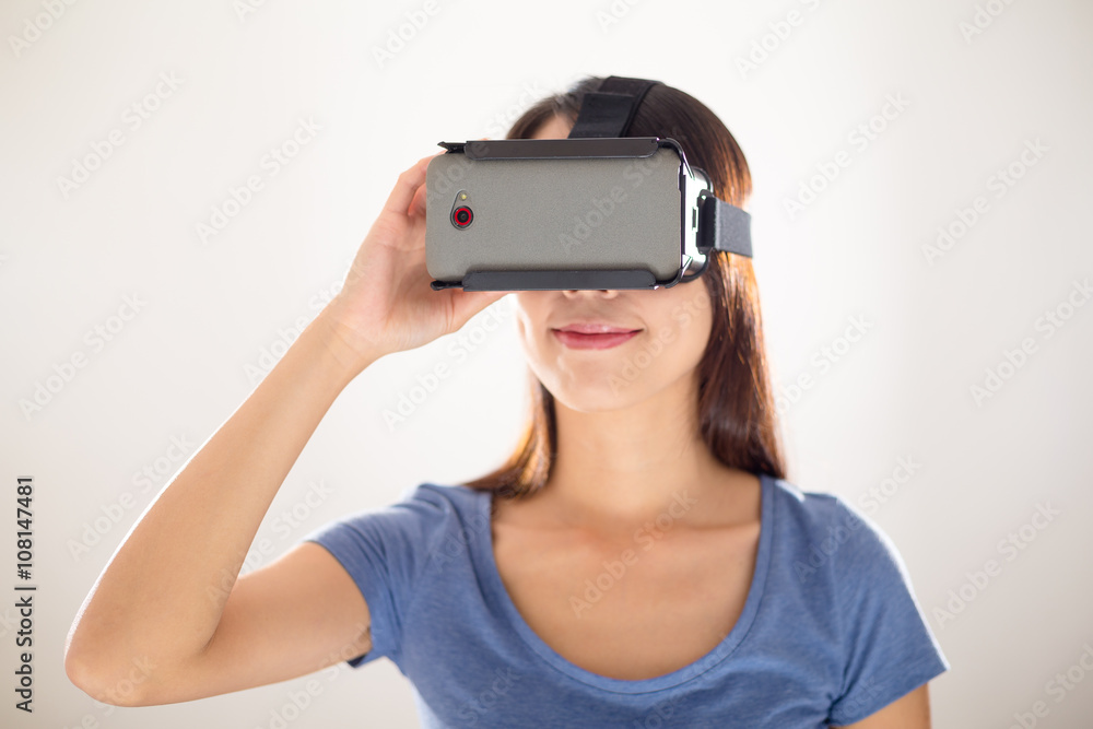 Young Woman wearing virtual reality device Young Woman wearing virtual reality device