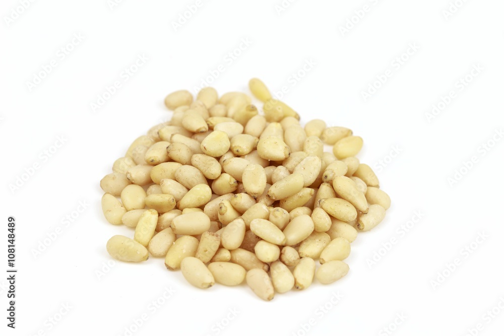 Dried pine nut seeds, on white background. Dried pine nut seeds, on white background.