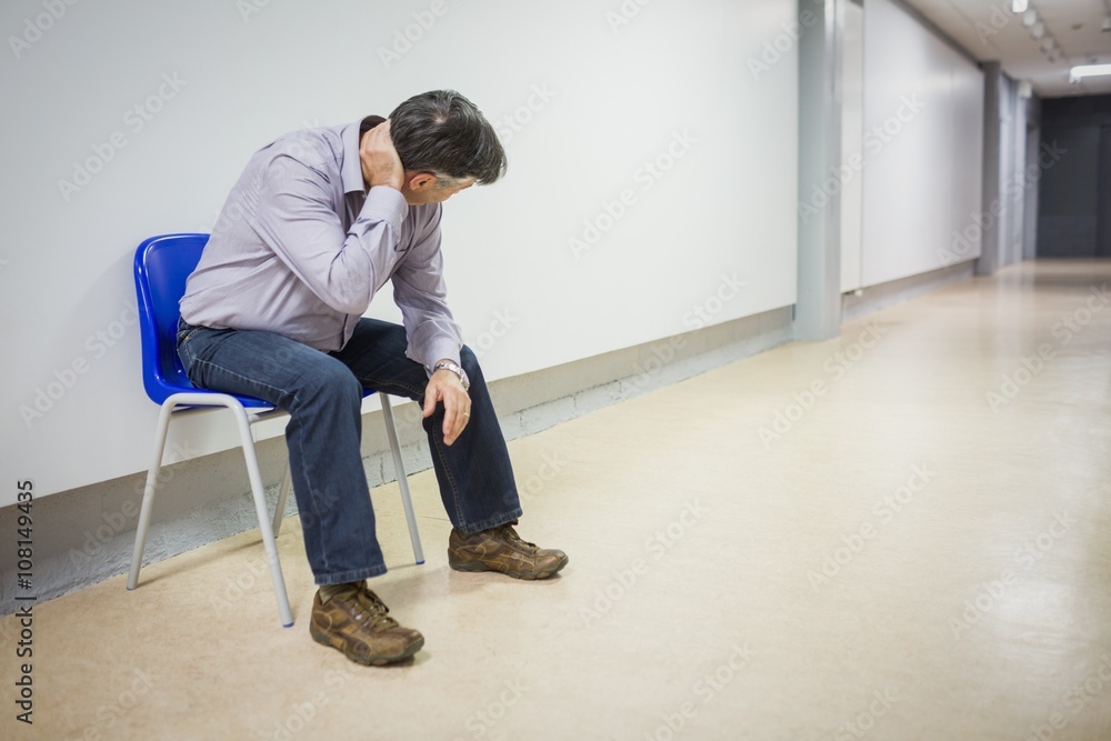 Professor sitting on chair Professor sitting on chair