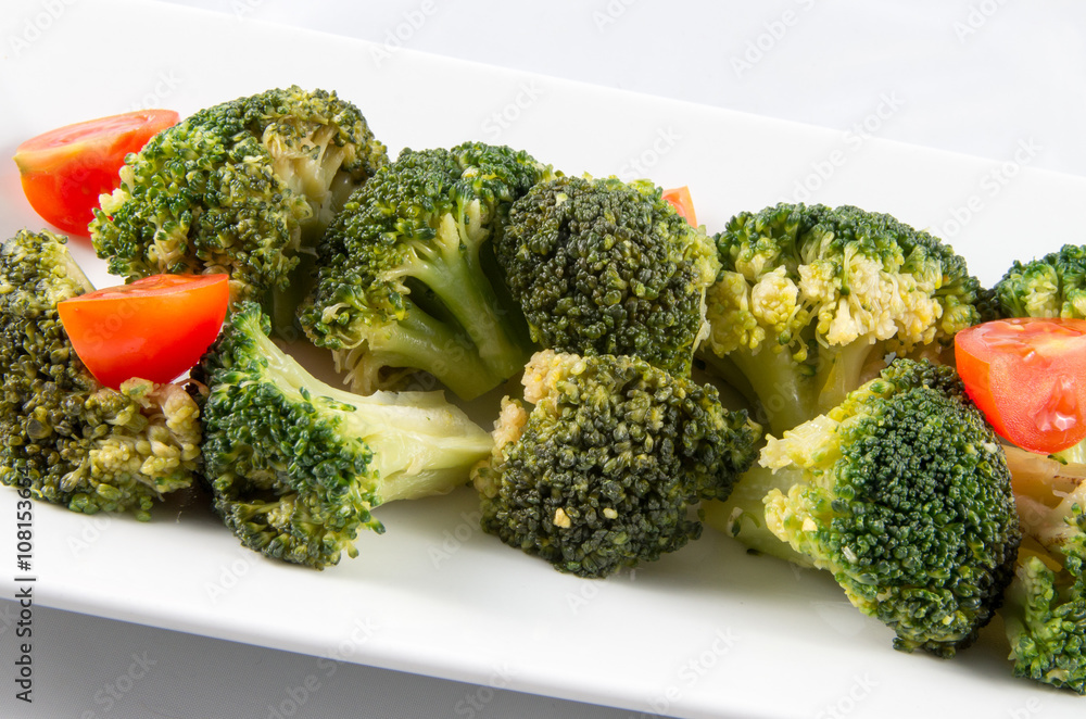 Broccoli and tomatoes. Vegetables raw. Vegetarian food. Broccoli and tomatoes. Vegetables raw. Vegetarian food.