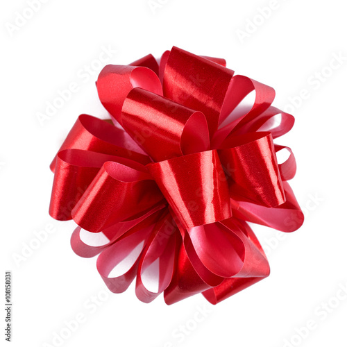 Red ribbon bow with tails isolated on white background.