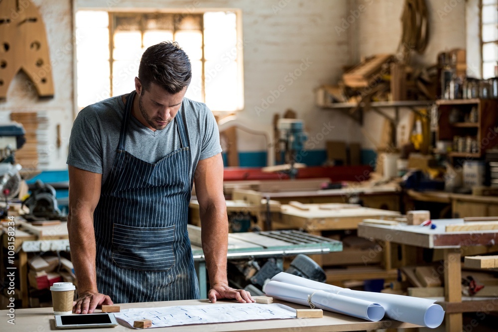 Carpenter working on his craft Carpenter working on his craft