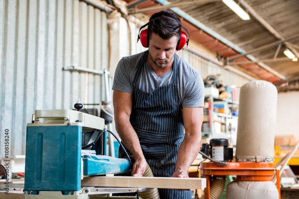 Carpenter working on his craft Carpenter working on his craft