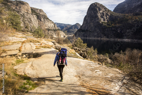 Caucasian mother carrying daughter in Yosemite National Park, California, United States photo