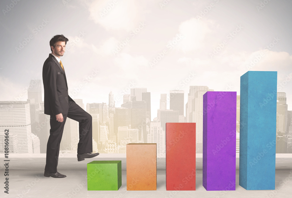 Business person climbing up on colourful chart pillars concept Business person climbing up on colourful chart pillars concept