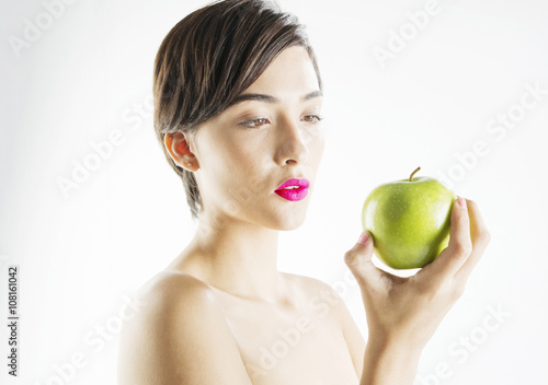 beautiful young woman with green apple