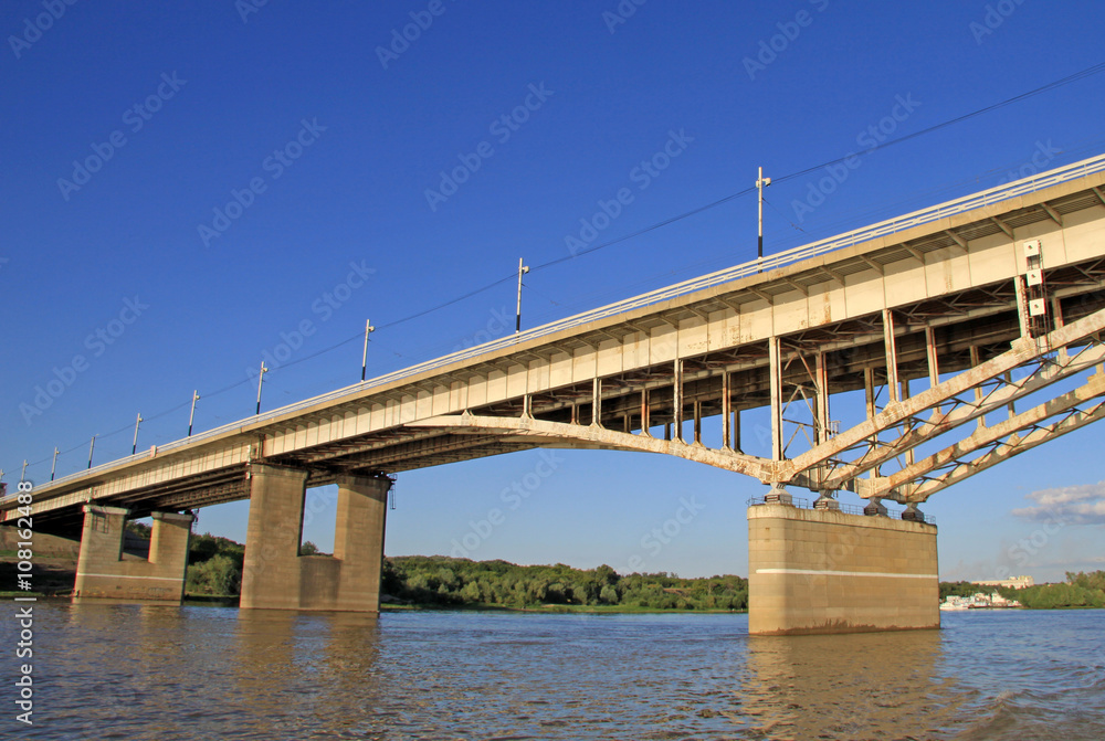 OMSK, RUSSIA - JUNE 21, 2010: Bridge named after the 60th anniversary of the Komsomol over the Irtysh River in Omsk, Russia