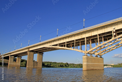 OMSK, RUSSIA - JUNE 21, 2010: Bridge named after the 60th anniversary of the Komsomol over the Irtysh River in Omsk, Russia