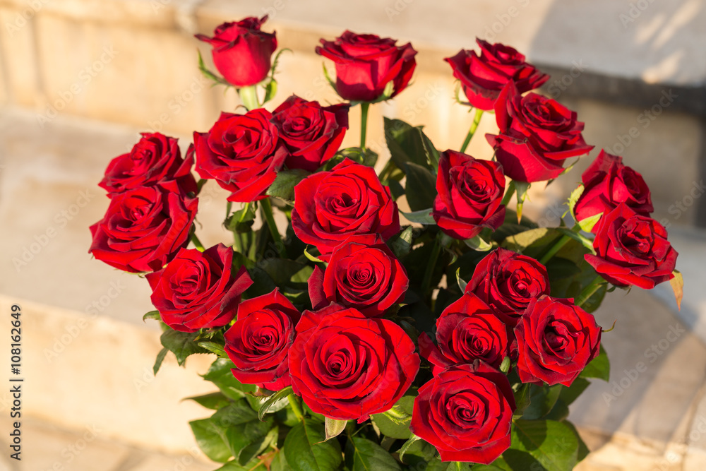 Fototapeta premium bouquet of blossoming dark red roses
