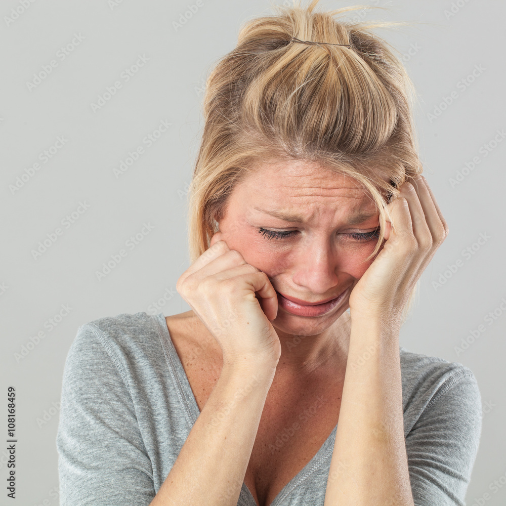 drama concept for depressed young blond woman in pain expressing regret drama concept for depressed young blond woman in pain expressing regret