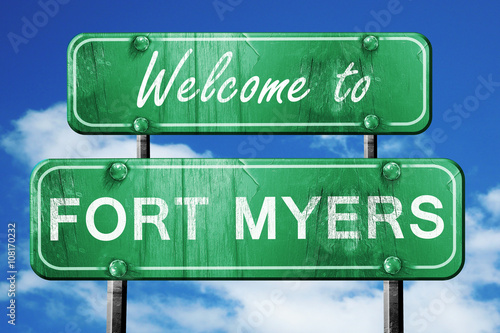 Картината върху платно fort myers vintage green road sign with blue sky background