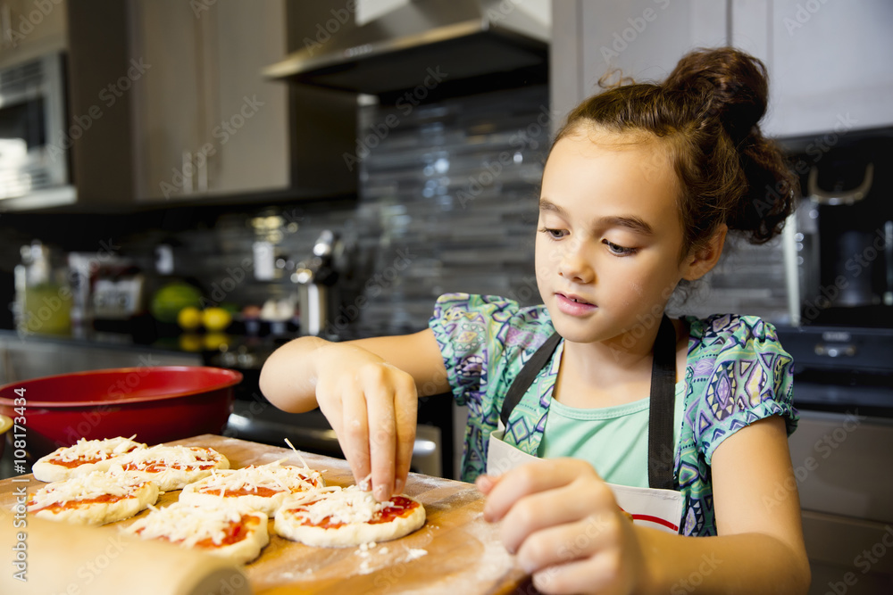 Girl making pizza in the kitchen Girl making pizza in the kitchen