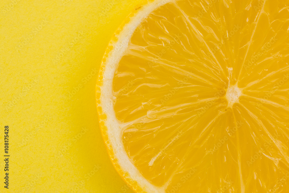 lemon on yellow background closeup lemon on yellow background closeup