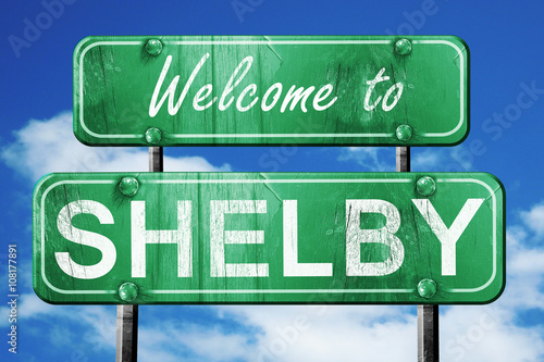 shelby vintage green road sign with blue sky background photo