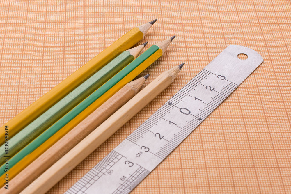 pencils and ruler on graph paper pencils and ruler on graph paper