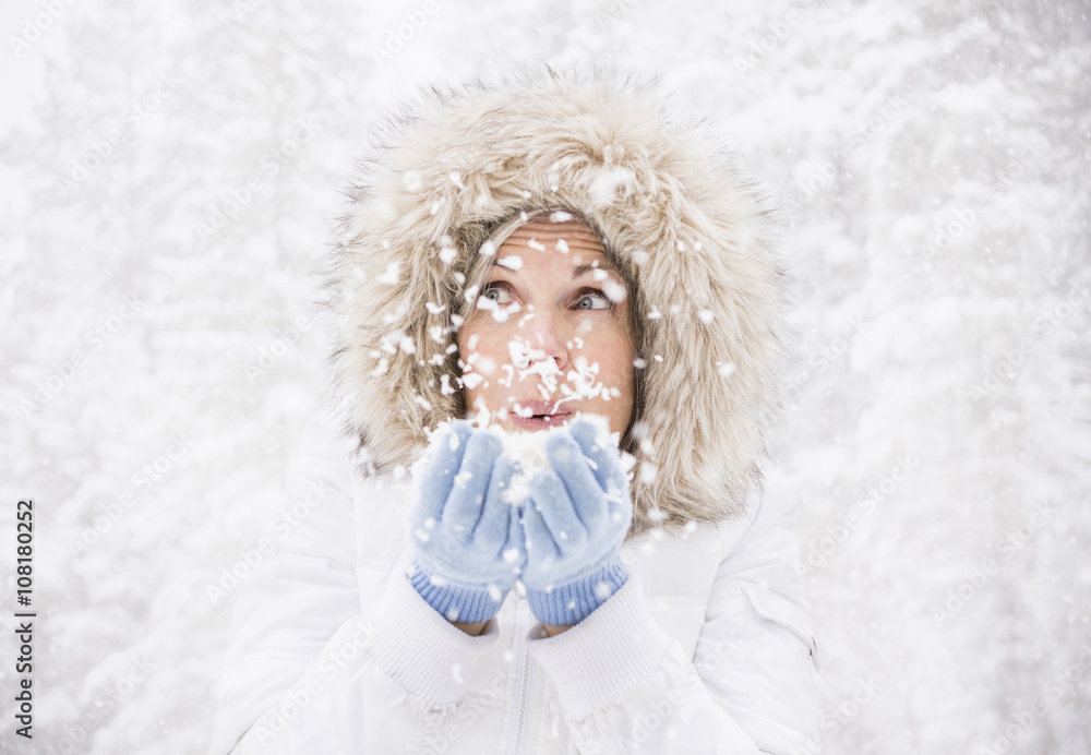 Caucasian woman playing in snow Caucasian woman playing in snow