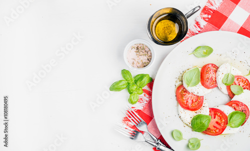 CLassic Italian Caprese salad with tomatoes, mozzarella di Buffala and fresh basil.