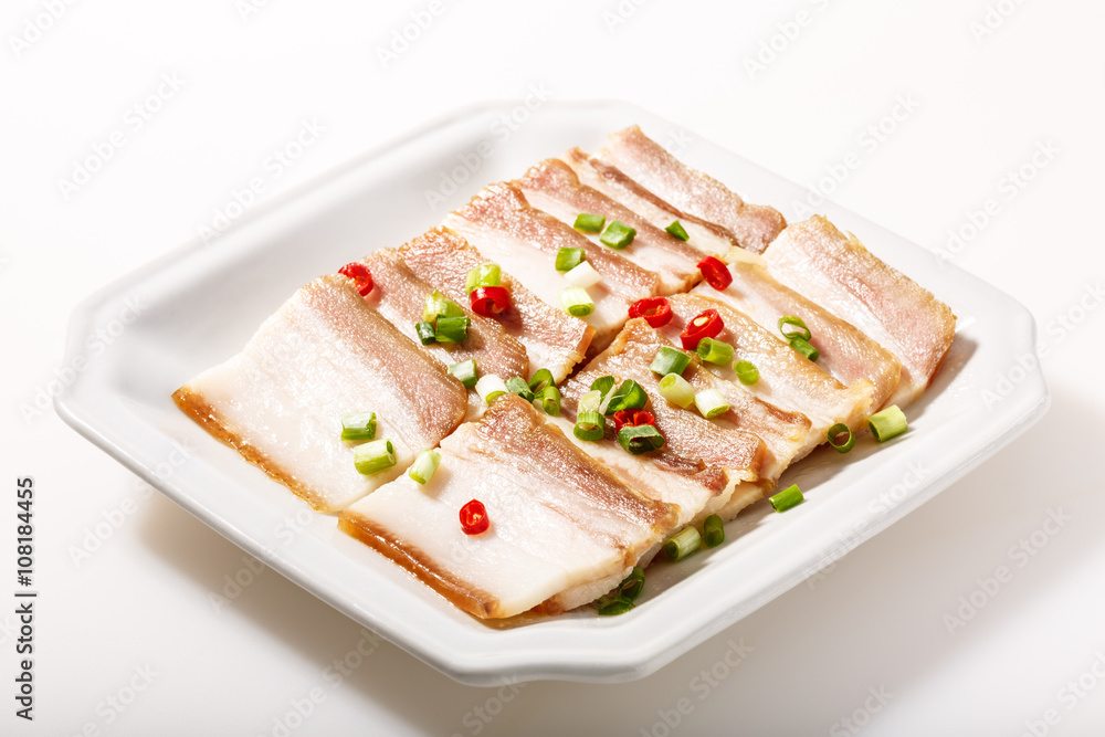 Cooked bacon On the white plate Cooked bacon On the white plate