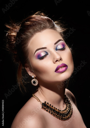 beautiful woman closed eyes with bright fashion make up