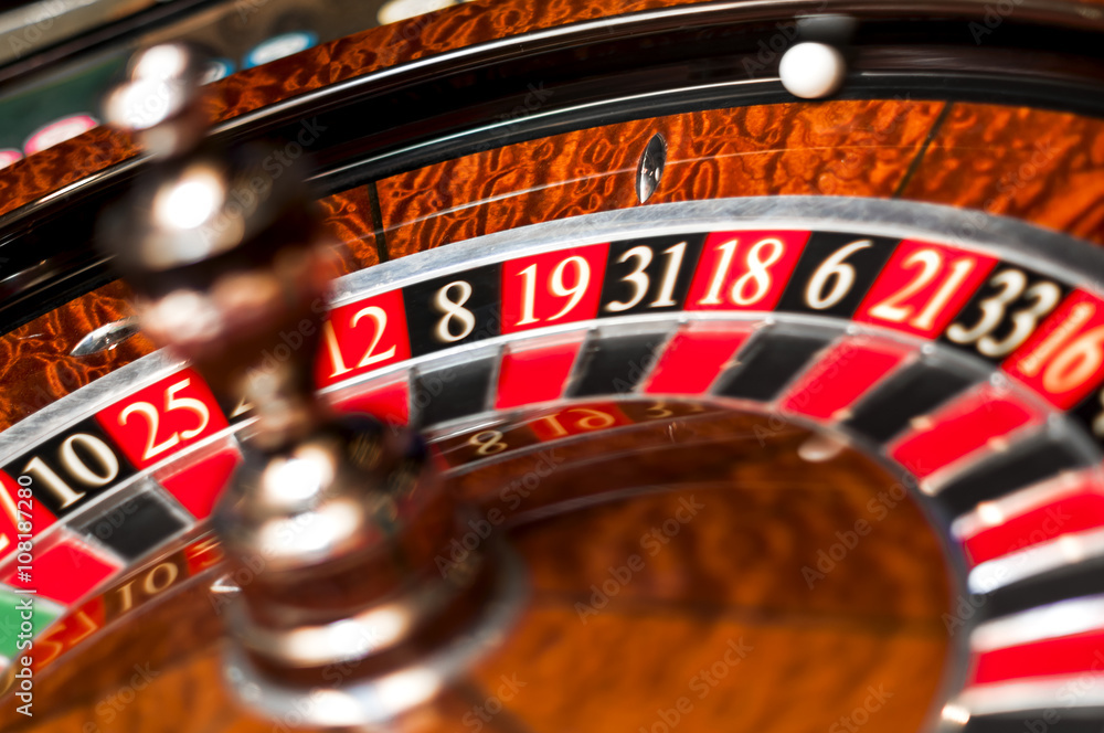 Casino roulette with both the wheel and the ball spinning Casino roulette with both the wheel and the ball spinning
