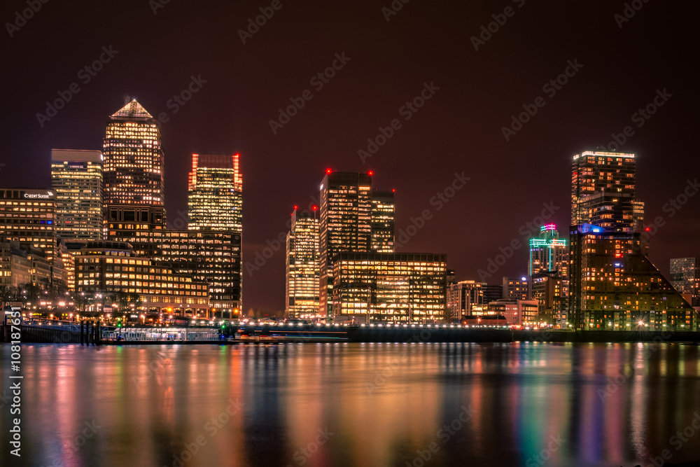 London skyline at night seen from across the river Thames, Canary Wharf is London’s financial district a place where the world’s greatest corporation and banks do business
