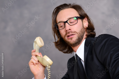 Fotografie businessman has a awkward  phone call