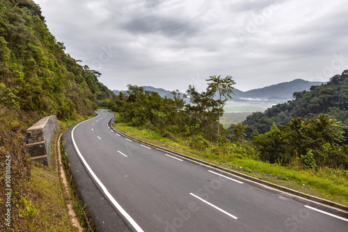 	Rwanda rainforests, the sky, the mountains and the road.
