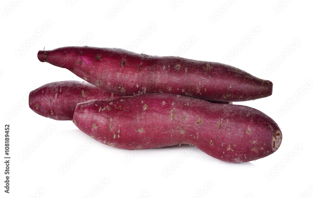 uncooked Japanese sweet potato on white background uncooked Japanese sweet potato on white background