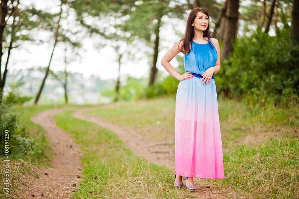 Young beautiful and cute girl posed at pine forest