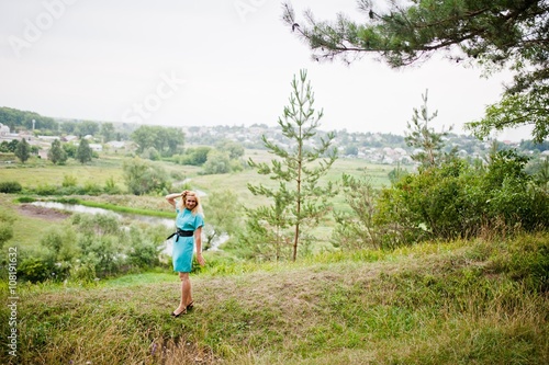 Adult blonde woman posed at pine forest © AS Photo Family