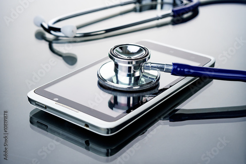 Phone repair and service concept.Smartphone being diagnosed with a stethoscope.
