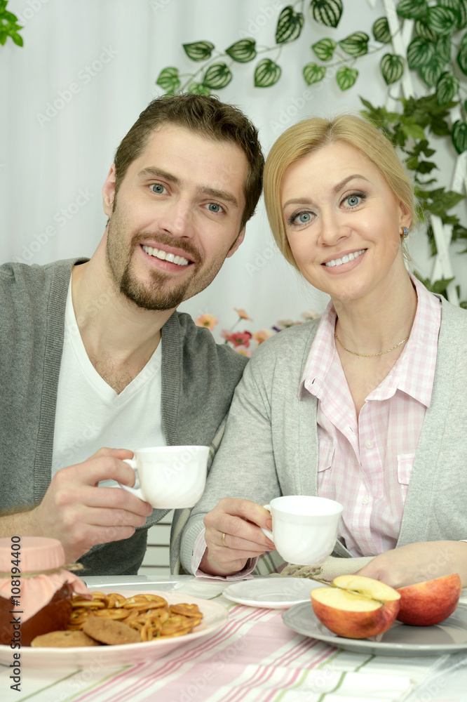 couple at table with coffee and food couple at table with coffee and food