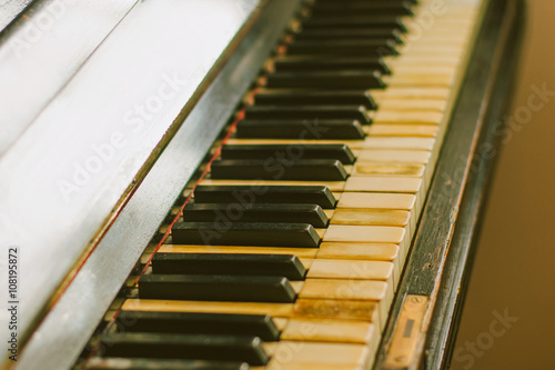 Old rusty piano keyboard, selective focus
