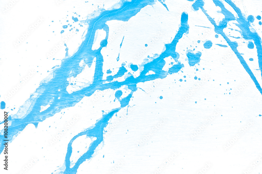 Blue watercolor background. Acrylic hand painted splash isolated on white background. Abstract acrylic paint splatter. Fashion and beauty. Indigo tone. Close up.