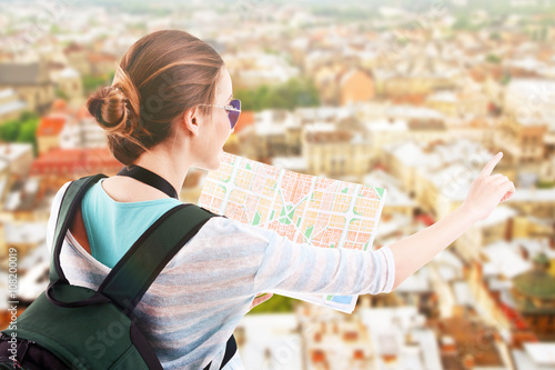 Traveler with map on city b...