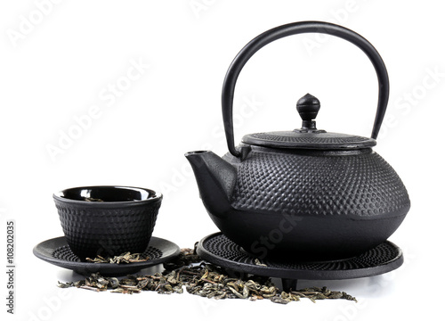 Green tea with black utensils, isolated on white