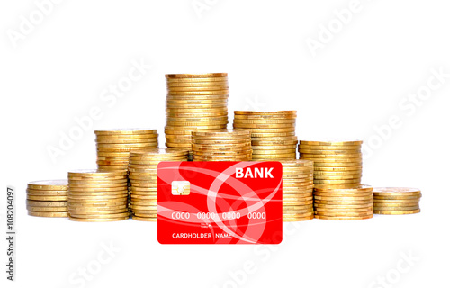 many golden coins in column and credit card isolated on white