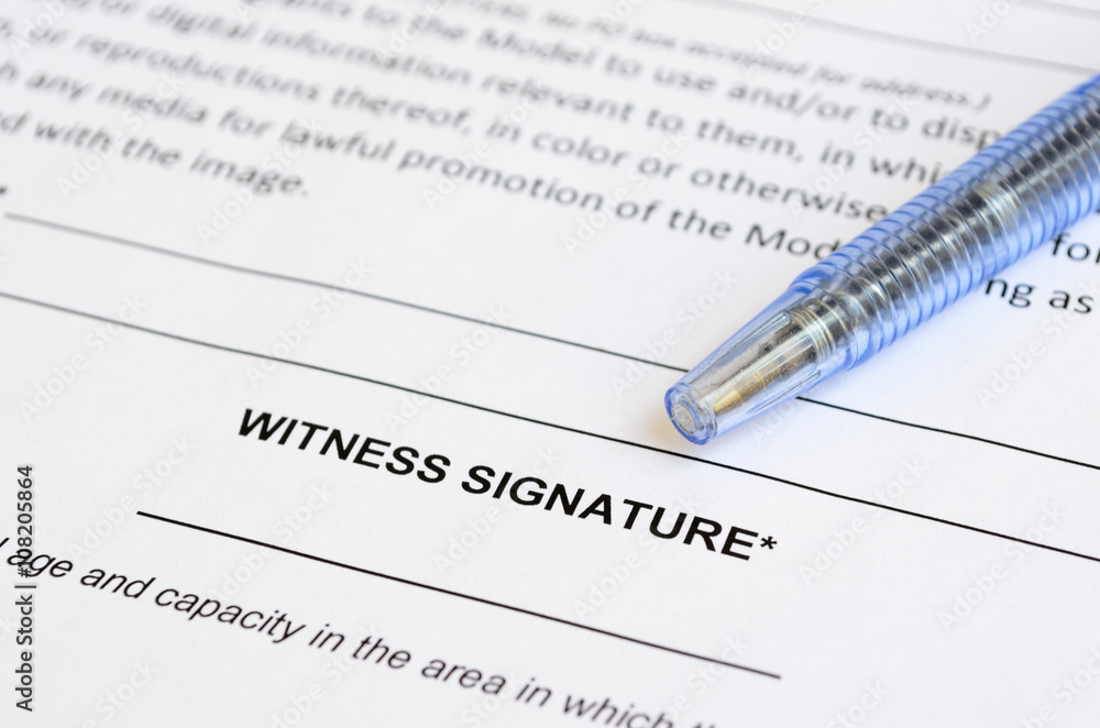 Closeup of witness signature area on a document with artistic shallow depth of field. Closeup of witness signature area on a document with artistic shallow depth of field.