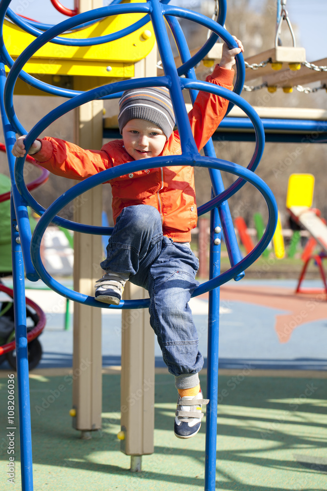 The three-year young boy on the playground The three-year young boy on the playground
