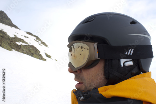 skier in a chairlift going up of a mountain