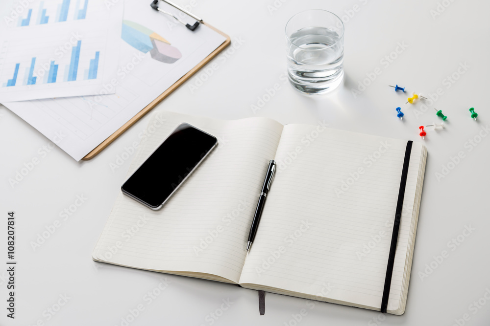 Desk with copybook and phone Desk with copybook and phone