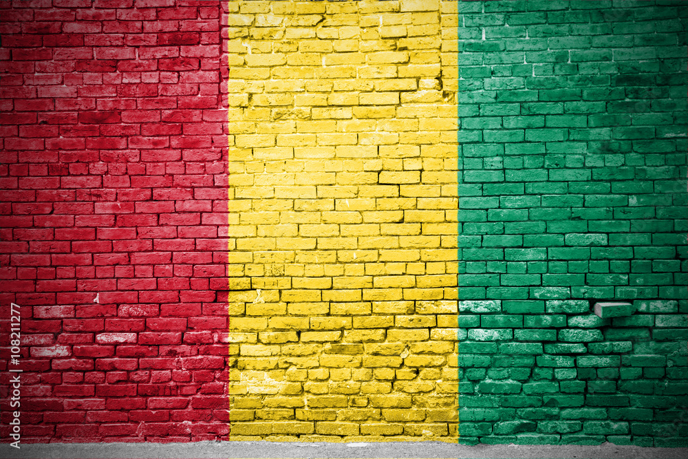 Ziegelsteinmauer mit Flagge Guinea Ziegelsteinmauer mit Flagge Guinea