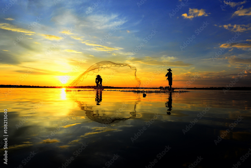 Fototapeta premium Two Fishermen in golden morning light..