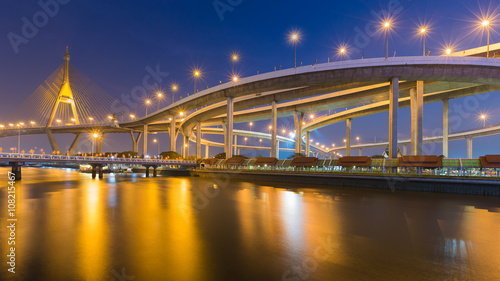 Bhumibol suspension Bridge in Thailand, also known as the Industrial Ring Road Bridge, in Thailand. The bridge crosses the Chao Phraya River at twilight. photo