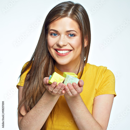 Happy beautiful woman show many little gift boxes on hands. photo