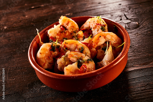 Bowl of shrimp appetizers on table
