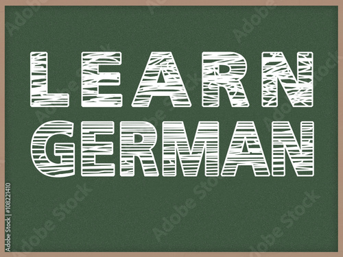 Learn another Language - Chalk on green blackboard