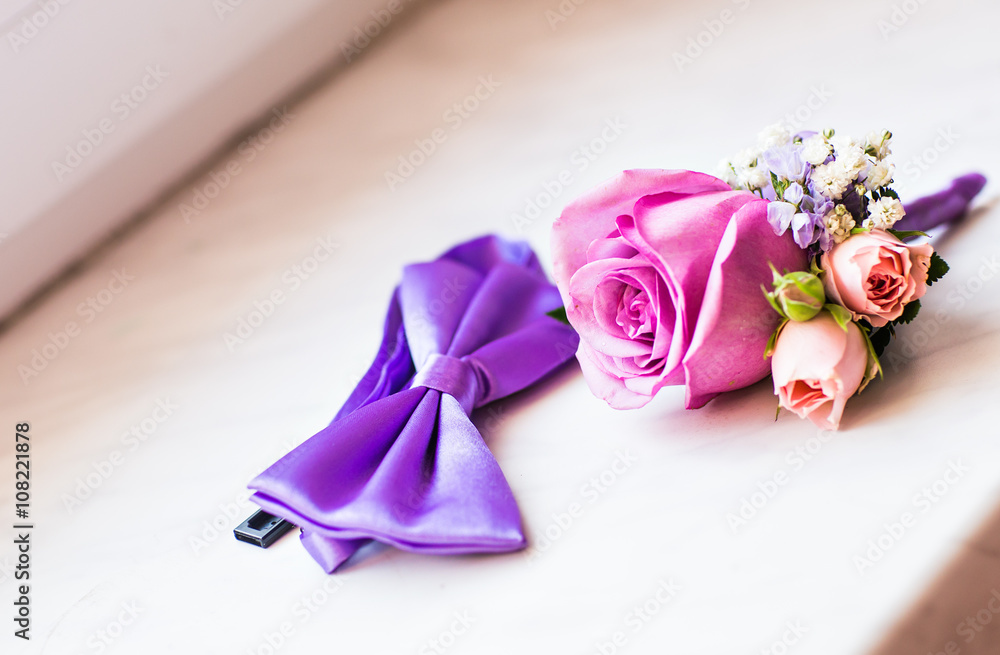 Gentle groom's boutonniere and bow-tie Gentle groom's boutonniere and bow-tie