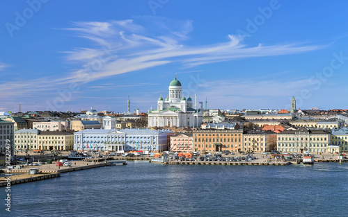 Helsinki, Finland. Scenic cityscape with Helsinki Cathedral, South Harbor, Market Square (Kauppatori) and beautiful cirrus clouds over them in the sunny spring day. photo